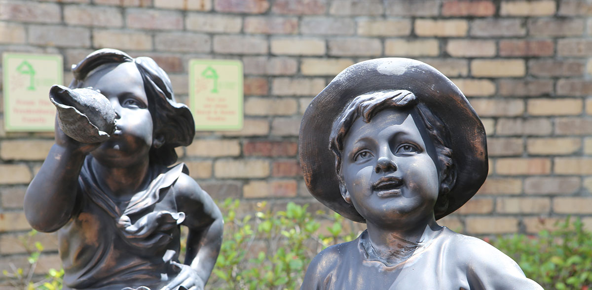 Gulf Coast Kid's House Statues